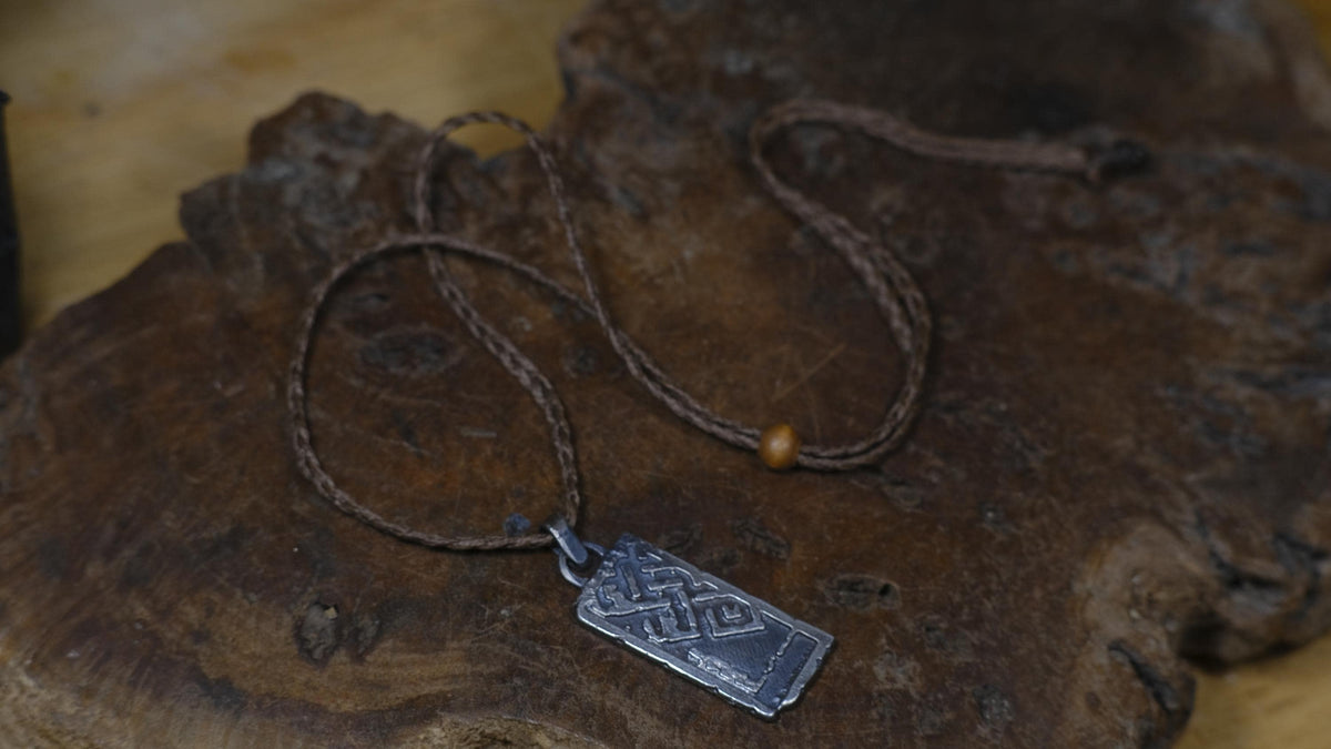 Handmade sterling silver Endless Knot Temple Relic talisman on adjustable cord