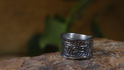 Delta Egyptian-inspired wide sterling silver ring with irregular textured band