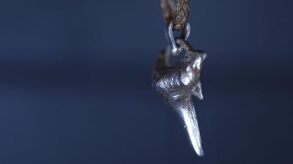 Sterling silver shark tooth talisman cast from a genuine fossil tooth on adjustable cord