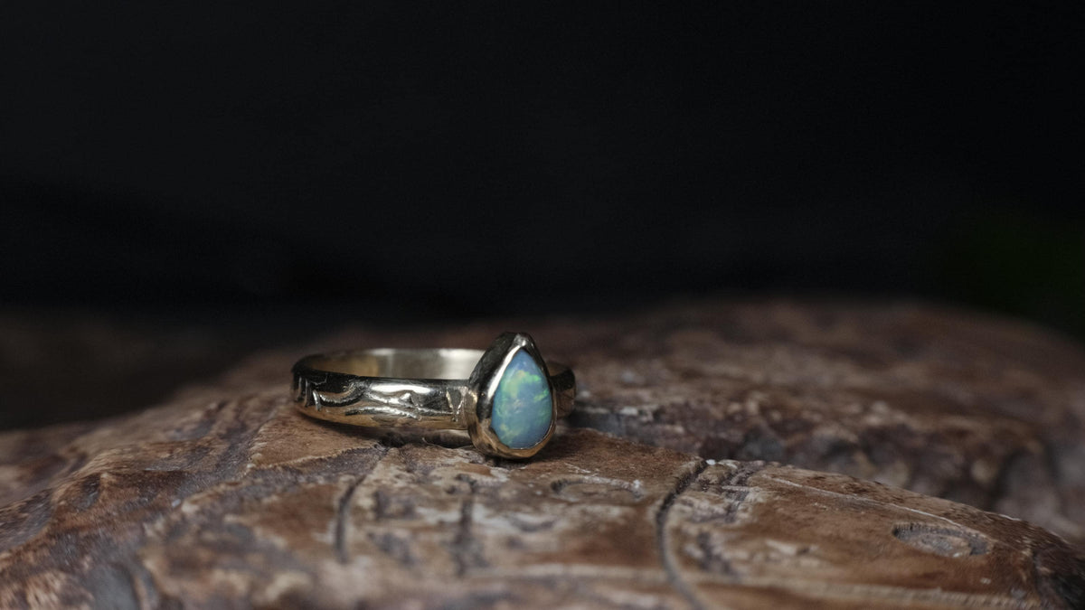 9ct yellow gold ring with Lightning Ridge crystal opal, angled front view