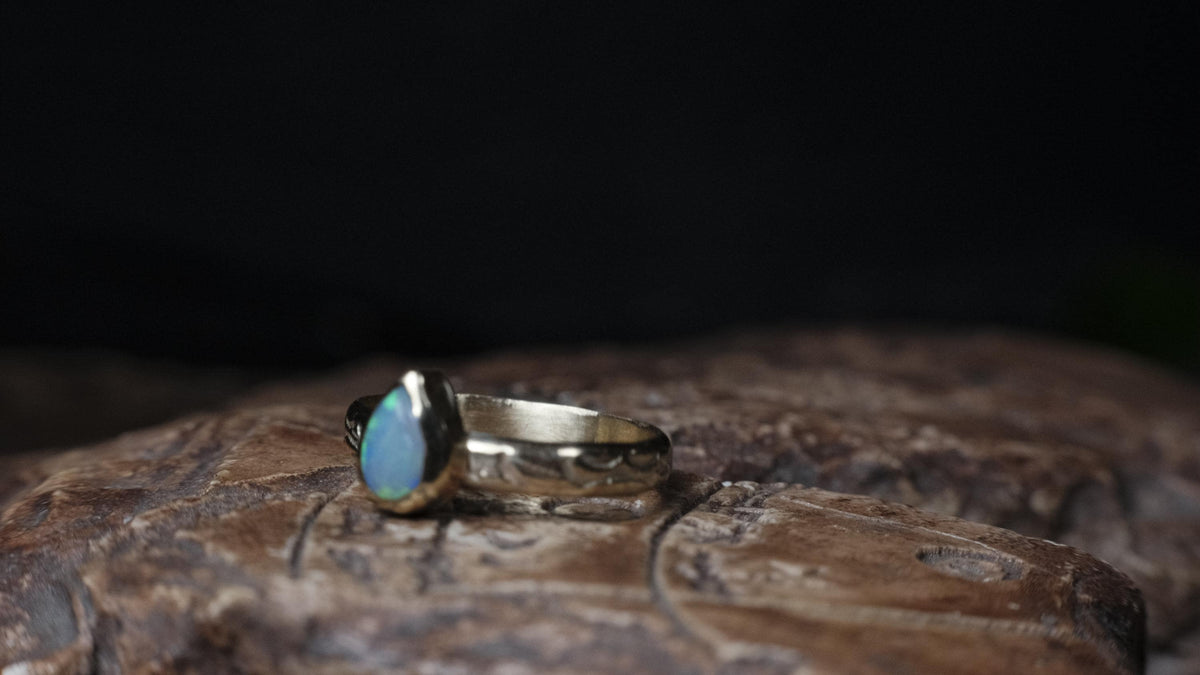 Angled view of the Lightning Ridge crystal opal ring