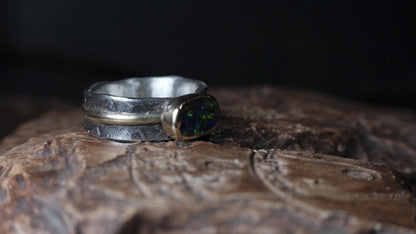 Blue green boulder opal ring with textured sterling silver band