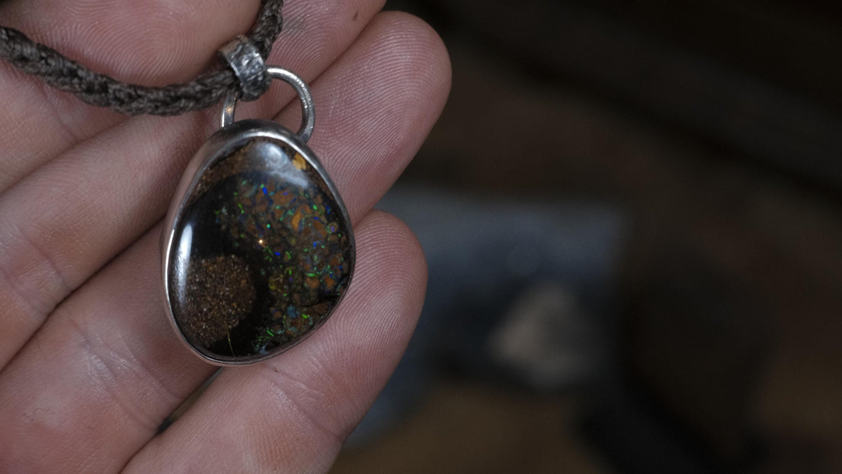 Close-up of Australian boulder opal in sterling silver setting
