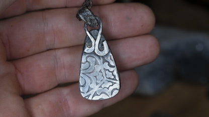 Australian matrix boulder opal pendant with rugged silver setting